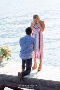 Man surprises girlfriend with a romantic proposal on Donner Lake on a warm summer day