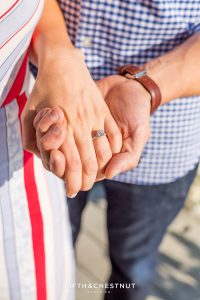 Closeup of new engagement ring while couple holds hands in Truckee after their proposal