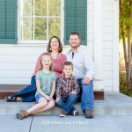 Family of four sits on old huffaker school steps for Bartley Ranch Portraits by Reno Family Photographer