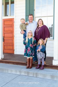 family of five wearing teal and purple poses for Bartley Ranch Portraits by Reno Family Photographer