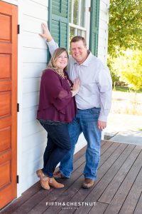 husband and wife snuggle for fall Bartley Ranch Portraits by Reno Family Photographer