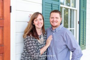 husband and wife smile and snuggle for Bartley Ranch Portraits by Reno Family Photographer