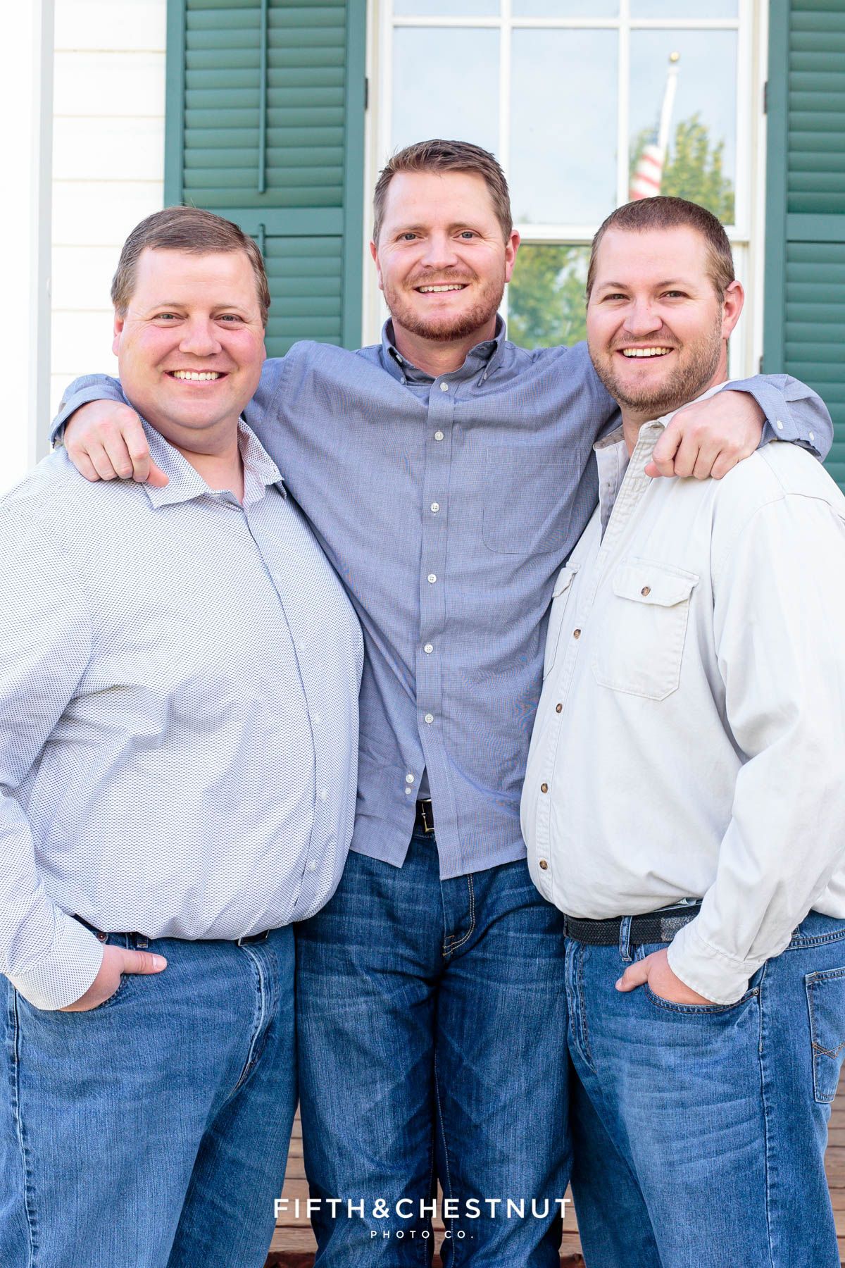 three brothers with their arms wrapped around each other for Bartley Ranch Portraits by Reno Family Photographer