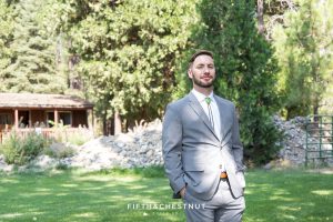 groom awaits his bride for their first look before their summer Greenhorn Creek Guest Ranch Wedding