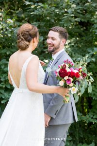 groom turns to see his bride for a first look at a Greenhorn Creek Guest Ranch Wedding