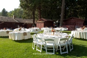 Wedding reception details for a wedding party in gray suits and floral dresses for a bright and summery wedding bouquet for a Greenhorn Creek Guest Ranch Wedding