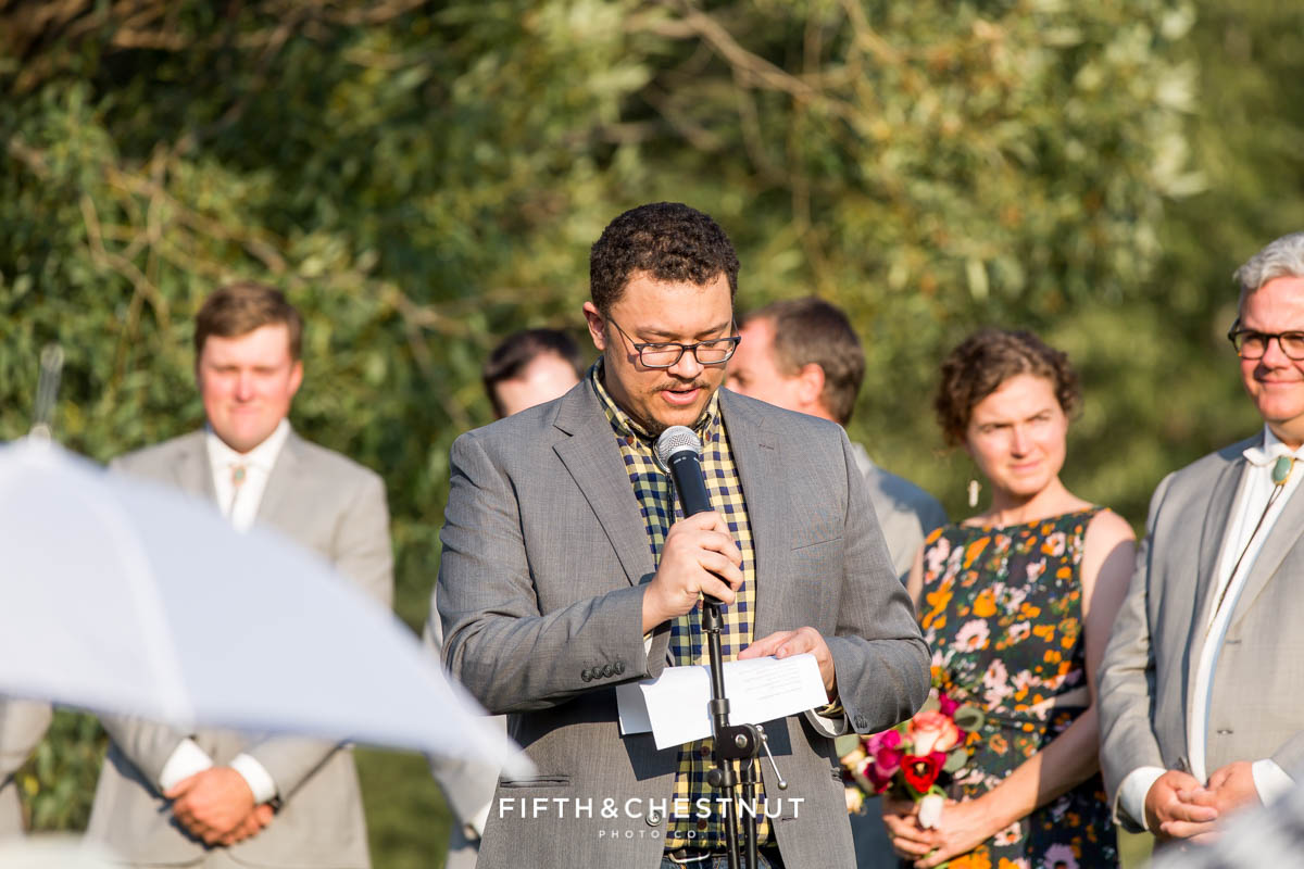 guest in yellow checkered shirt gives speech during a Greenhorn Creek Guest Ranch Wedding
