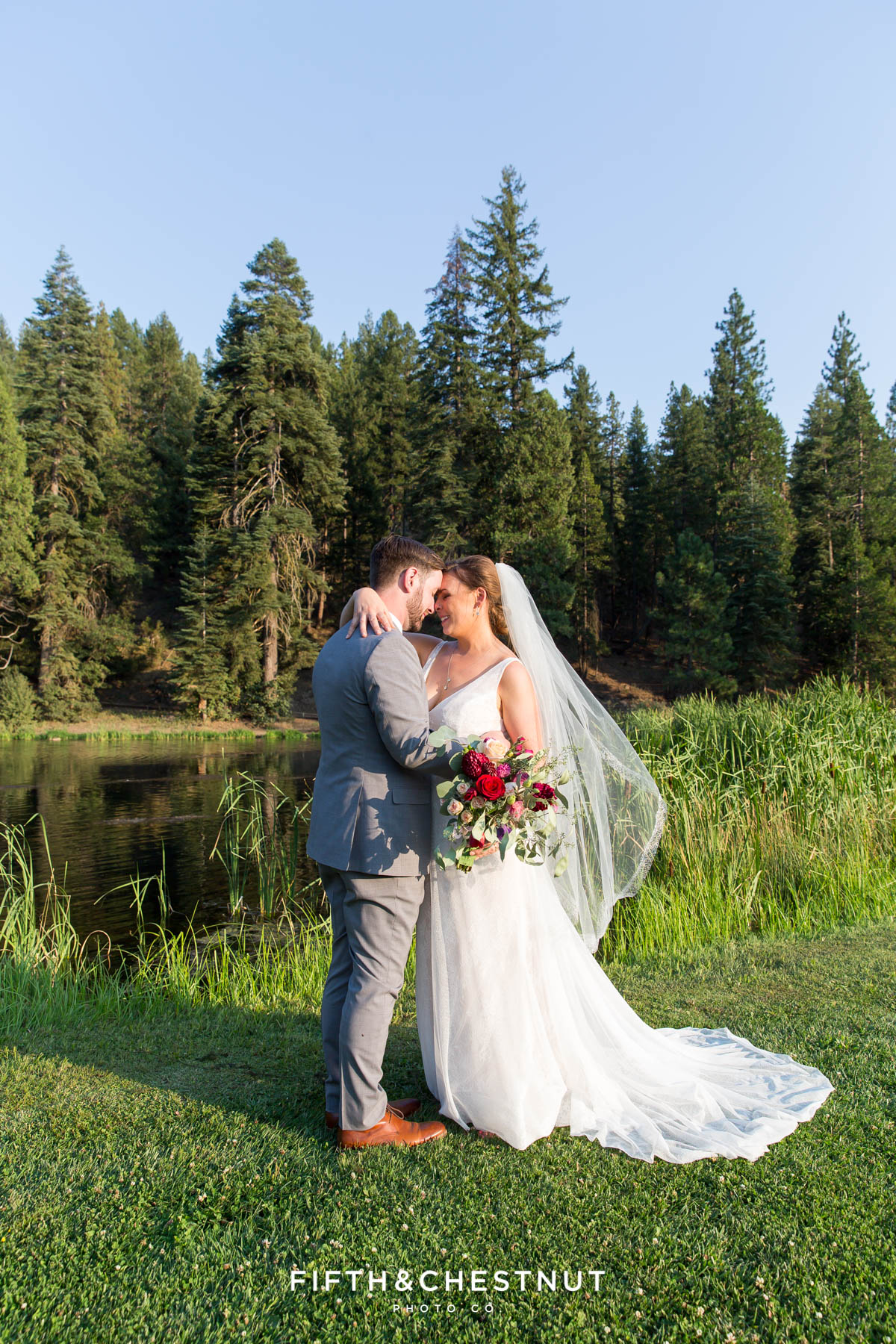 portrait of bride and groom snuggling close after their Greenhorn Creek Guest Ranch Wedding ceremony