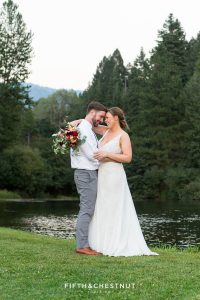 romantic portrait of bride and groom in front of a pond in Quincy, CA