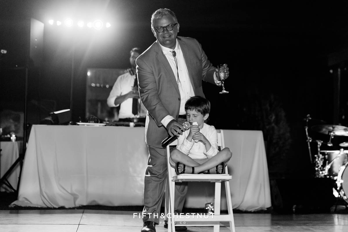 best man gives a speech with the help of his son at a Greenhorn Creek Guest Ranch Wedding