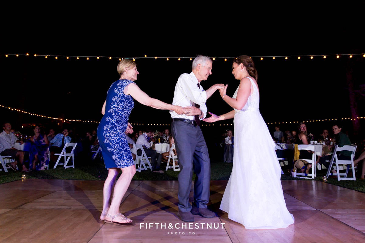 bride dances with her father and mother during a Greenhorn Creek Guest Ranch Wedding