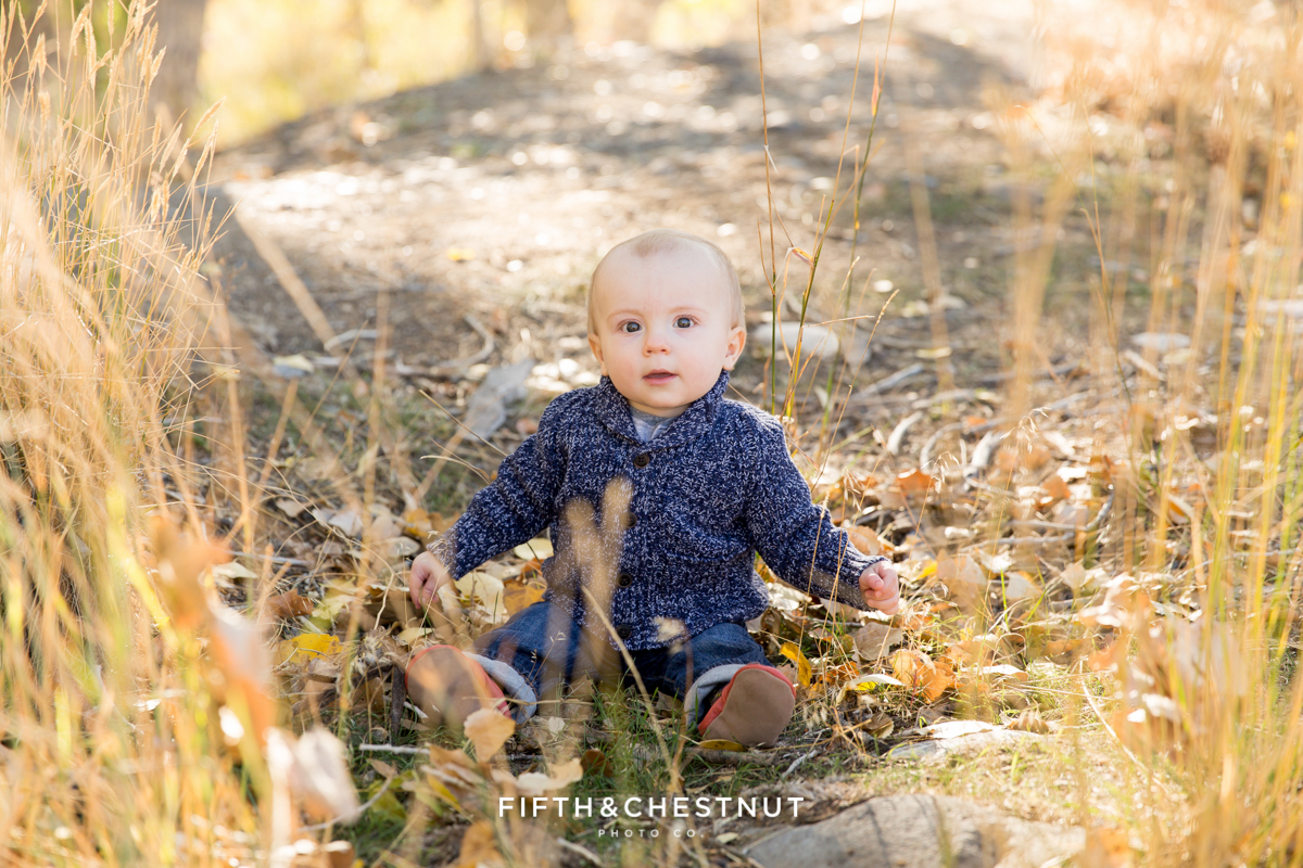 baby boy playing with sticks for his Mayberry Park Portraits