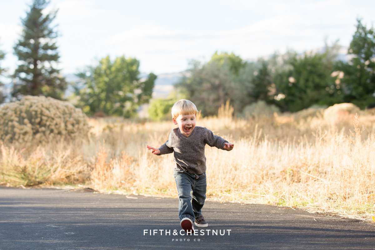 Mayberry Park Portraits portray a toddler running with his arms stretched out wide