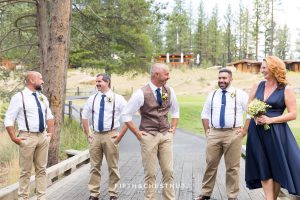 Groom laughs with his wedding party before his same-sex wedding at PJ's at Gray's Crossing in Truckee