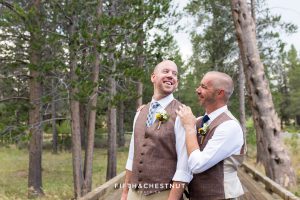 Grooms smile at one another before their beautiful PJ's at Gray's Crossing wedding