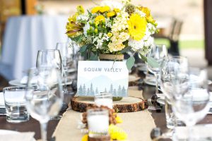 Table setting and yellow flowers by Suzu's Petals for a Truckee Wedding at PJ’s at Gray’s Crossing