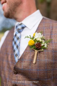 Close-up shot of groom's boutonniere by Suzu's Petals for his Truckee Wedding at PJ’s at Gray’s Crossing