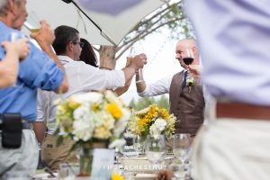 groom and guests raise glasses at a Truckee Wedding at PJ’s at Gray’s Crossing