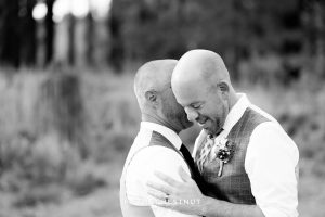 Grooms embrace during first dance for a PJ's at Gray's Crossing wedding