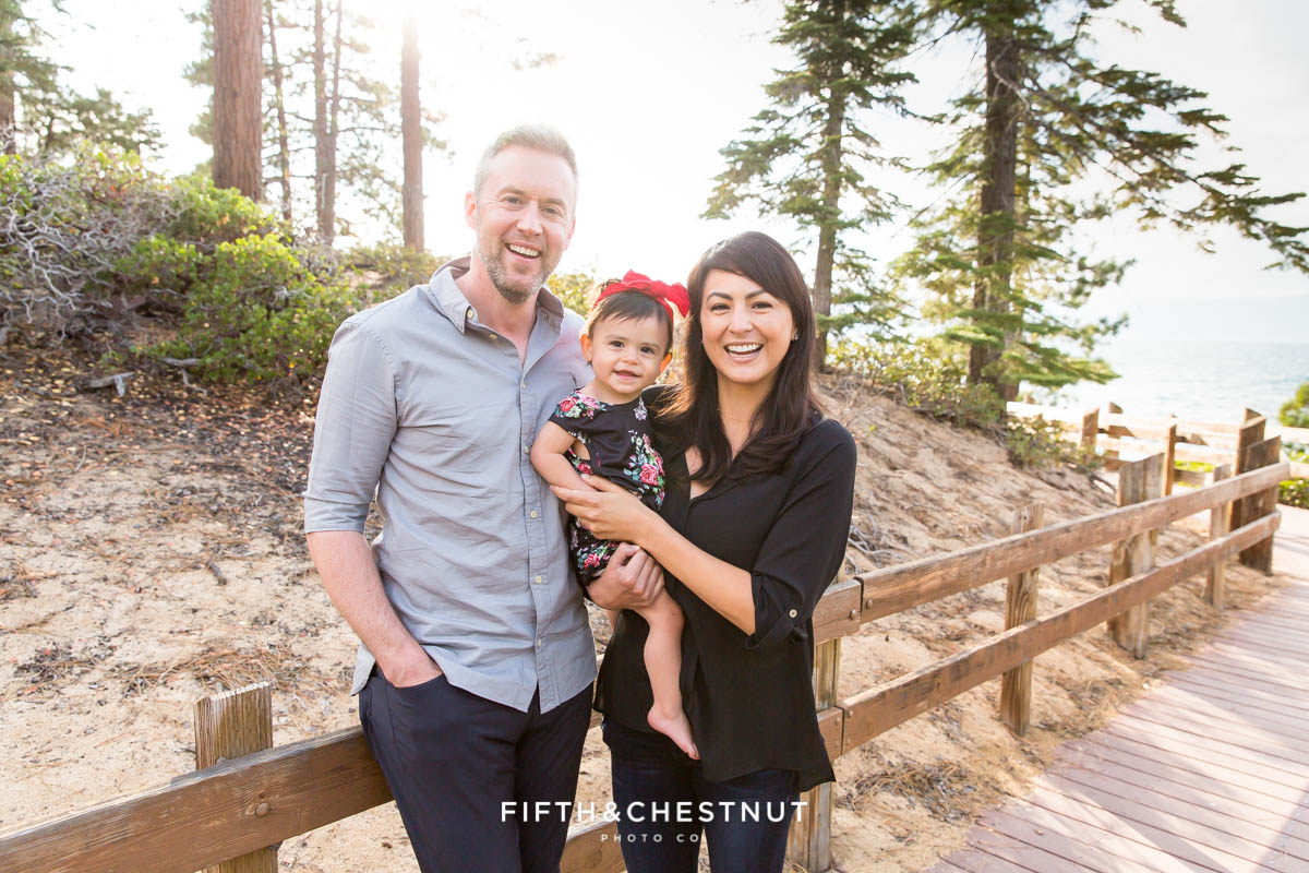 Family portrait of mom, dad and one year old girl in lake tahoe by Reno Family Photographer