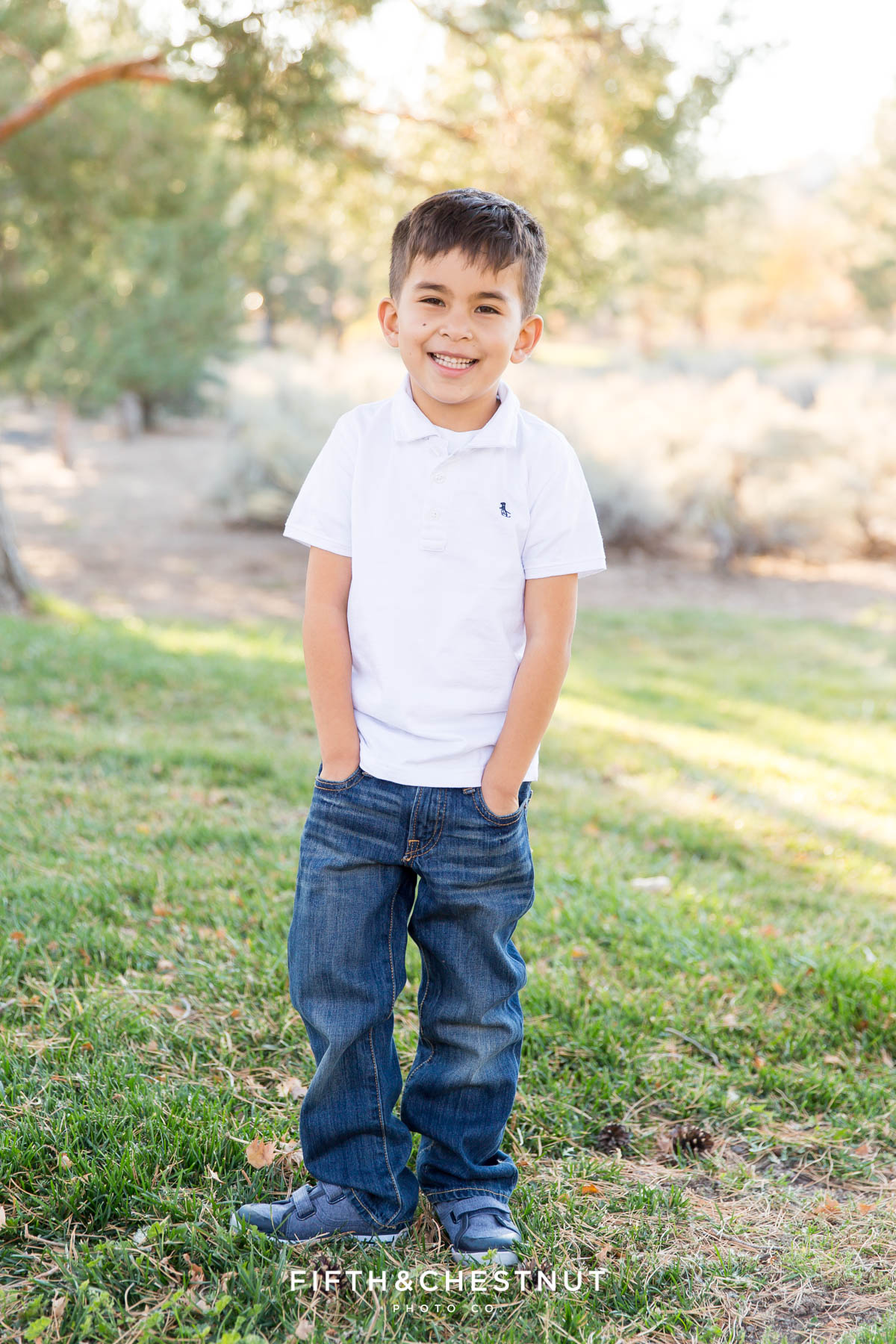 Portrait of 6 year old boy in white shirt for his Caughlin Ranch Family Portraits