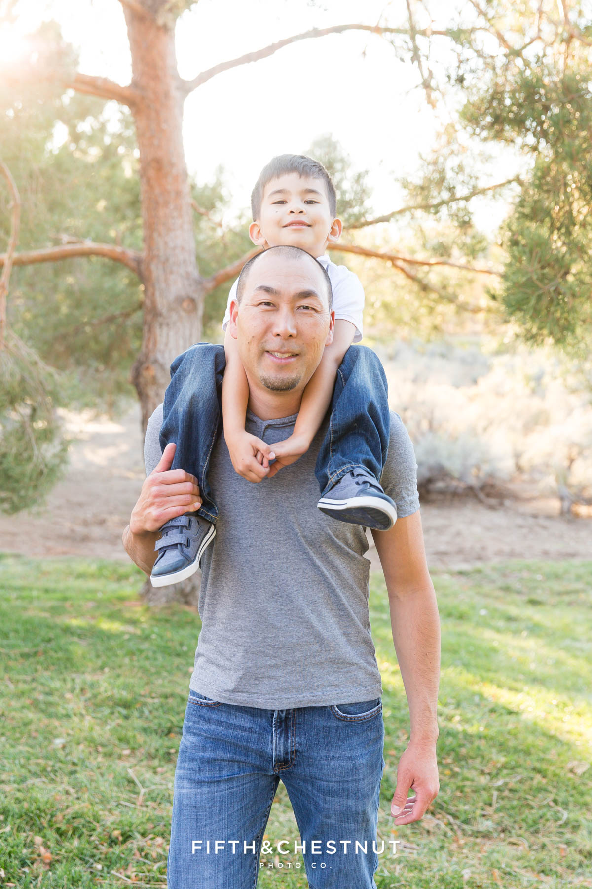 6 year old son rides on his dad's shoulders for their Caughlin Ranch Family Portraits