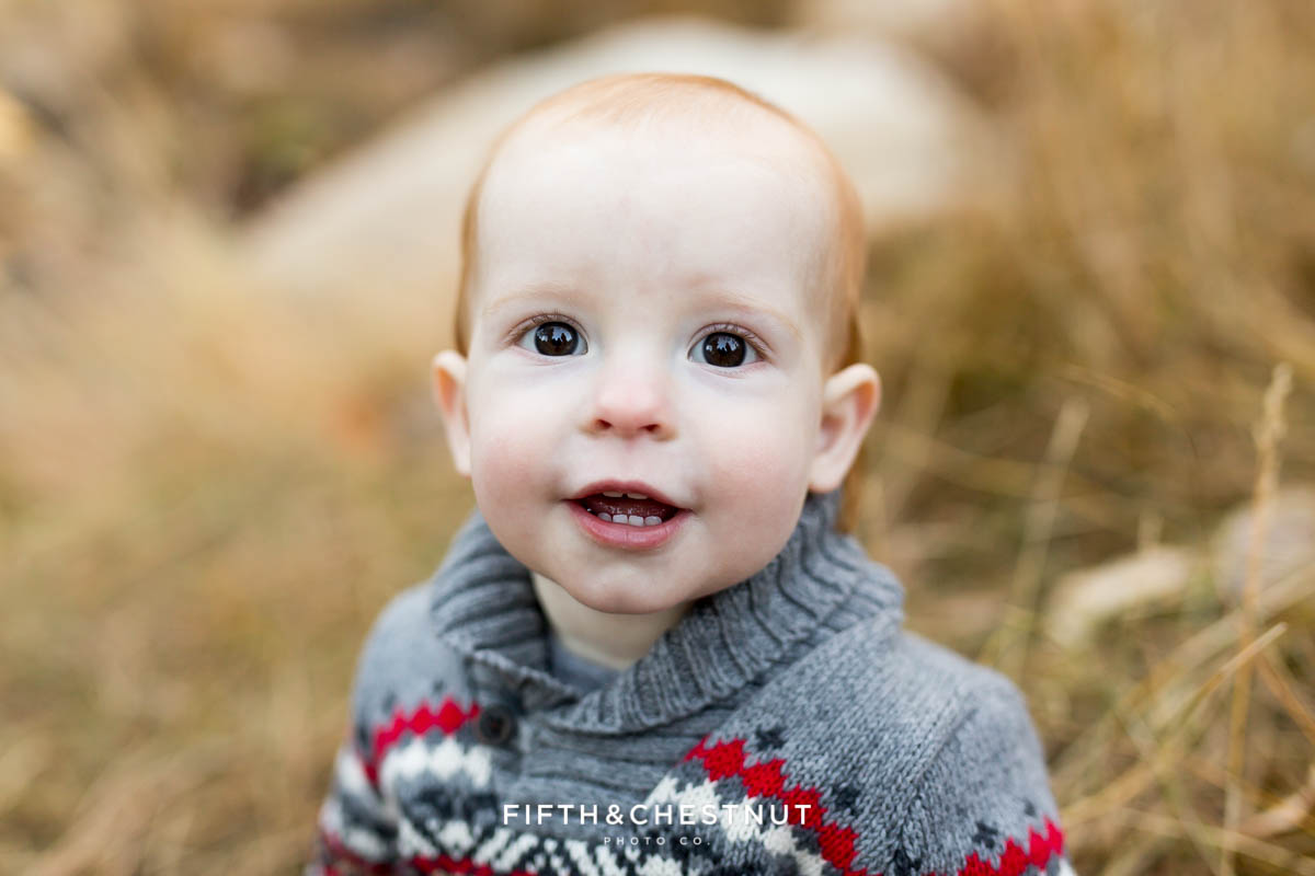 baby looking towards camera with curious expression during his reno family photos at galena creek park