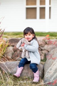 Sweet toddler holds her stuffed bunny at Bartley Ranch for her adorable family portraits by Reno Family Photographer
