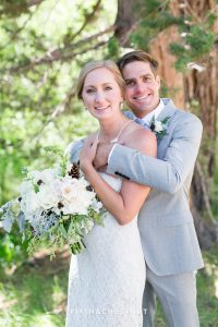 bride and groom snuggling for a portrait for their zephyr cove wedding by lake tahoe wedding photographer