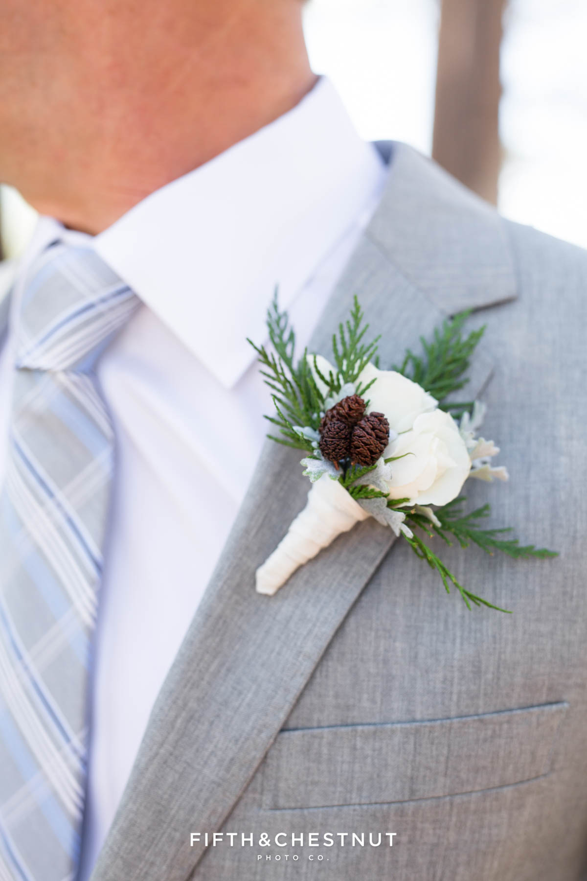 boutonniere by twine and dandy on a groom's lapel