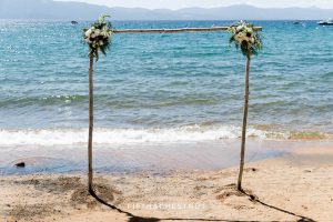 wedding arch florals for a tahoe wedding with lake tahoe in background