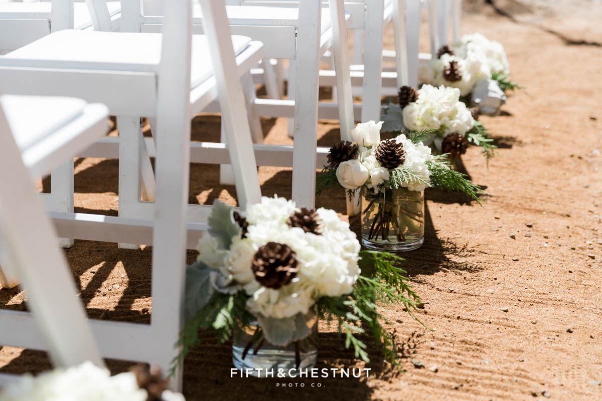 wedding aisle lined with flowers by twine and dandy for a lake tahoe summer wedding