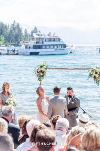 lake tahoe summer wedding ceremony with lake in background by lake tahoe wedding photographer