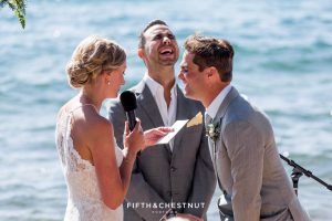 officiant and groom crack up at bride's vows during a lake tahoe wedding ceremony