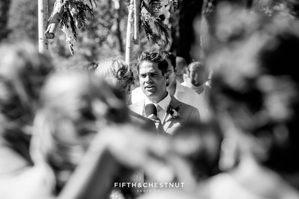 groom reads his vows at a lake tahoe wedding