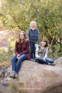 sisters pose for a picture on a rock for their Galena Creek Reno fall portraits