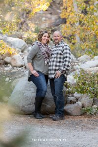 a mother and father stand together during Galena Creek Reno fall portraits by Reno Family Photographer