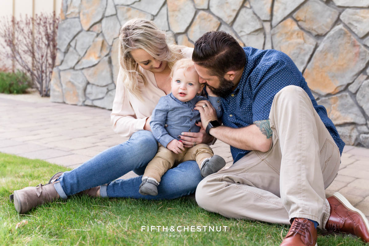 Family snuggling together for Golf Themed One Year Photos by Reno Baby Photographer