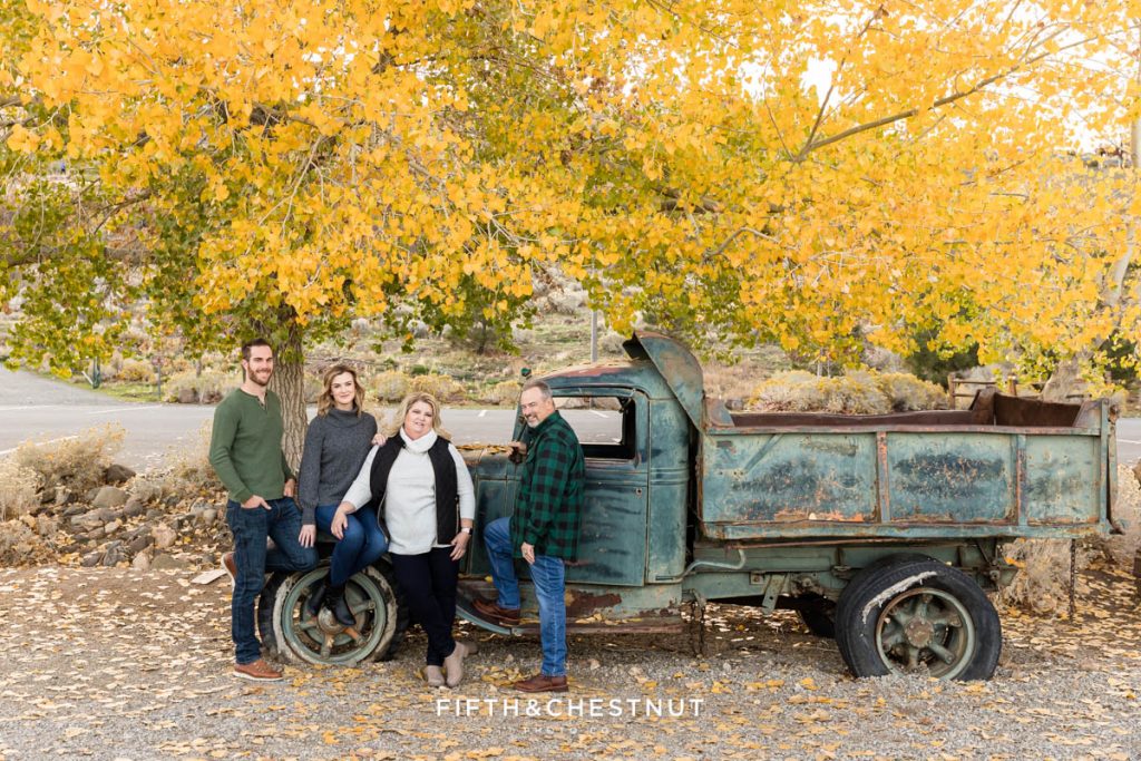 rustic Reno family portraits in front of a vintage blue truck