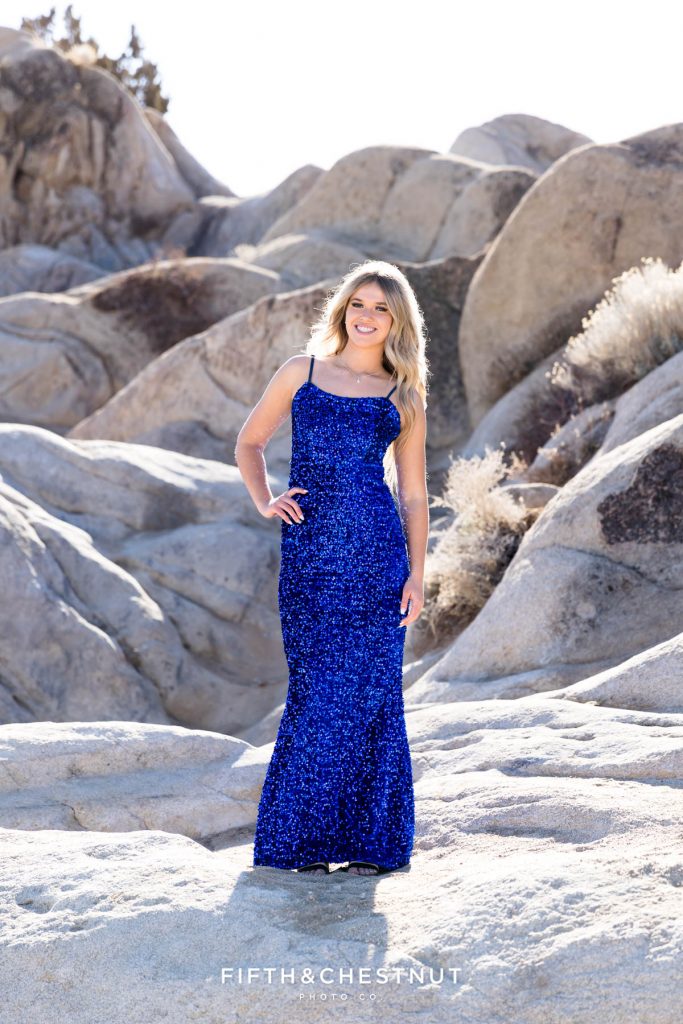 Elegant and desert juxtaposition with a high school senior in a sparkly blue dress at Moon Rocks for Reno Senior Portraits by Reno Senior Photographer