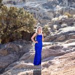 A striking portrait of a Reno High School Senior in a sequin royal blue dress during her high school senior portrait session by Reno Senior Photographer at Moon Rocks in Nevada