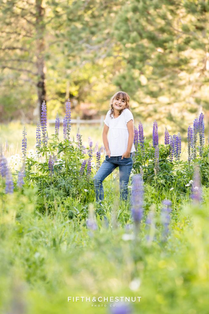 Spring wildflower portraits of sisters by Reno Family Photographer during the lupine superbloom