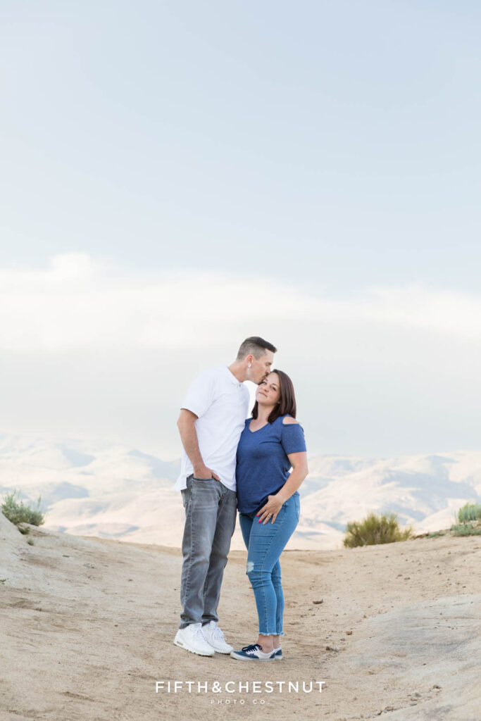 Moon Rocks Family Portraits with a family wearing light blue, gray and other neutral tones on a stunning summer evening with Reno Family Photographer.