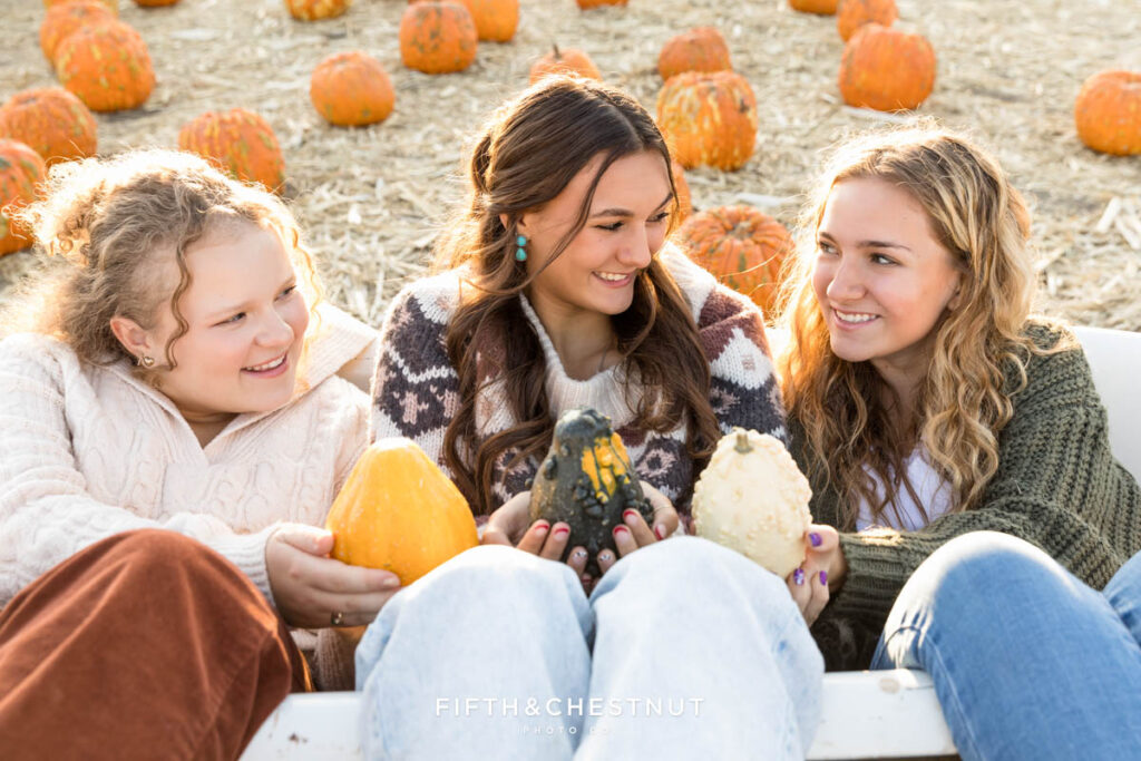 Class of 2024 Fifth and Chestnut Senior VIP Team Pumpkin Patch Portraits in Reno with Kenzie, Audrey and Natalie by Reno Senior Photographer at Ferrari Farms.