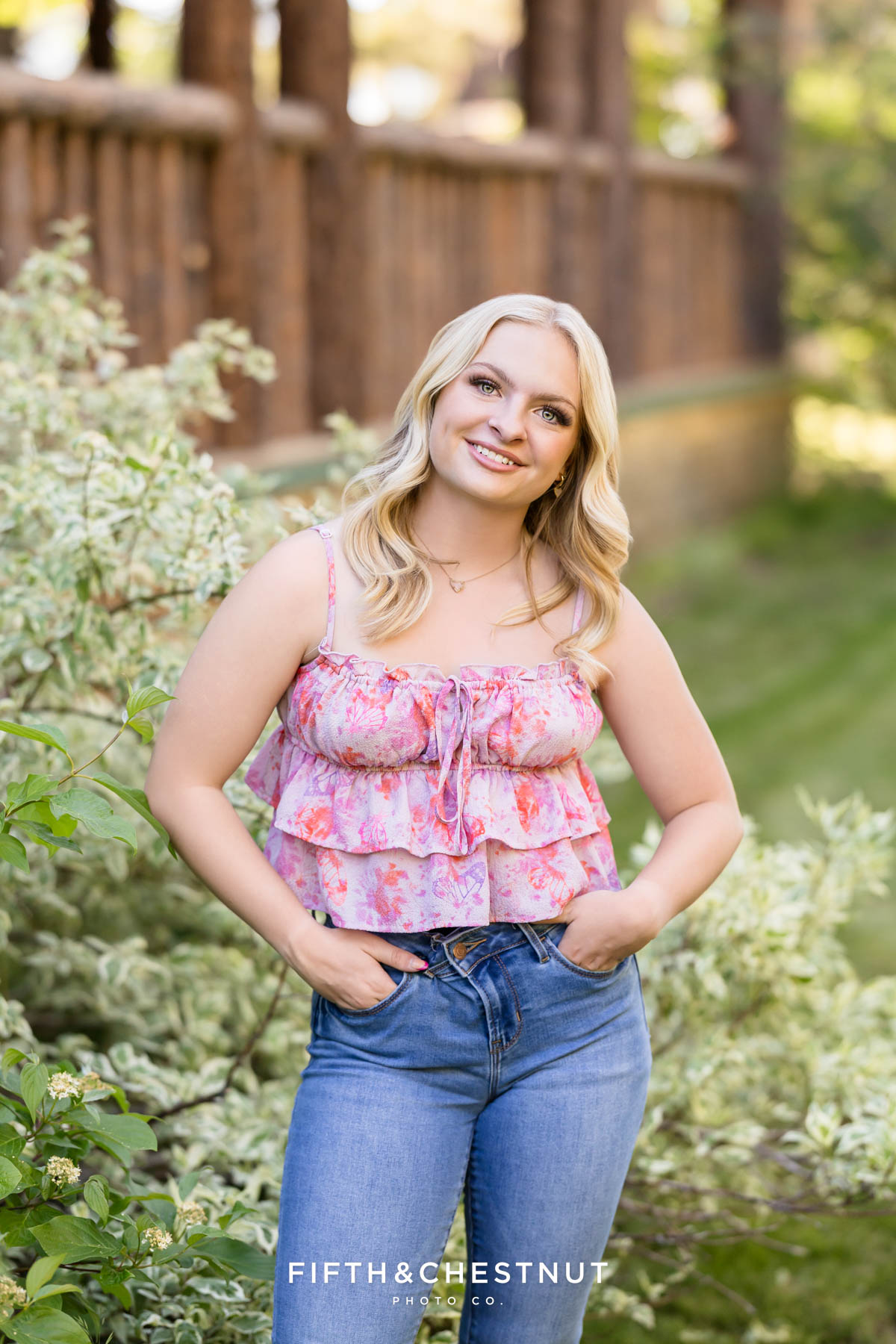Reno High School Senior posing in jeans and a floral top at Valhalla