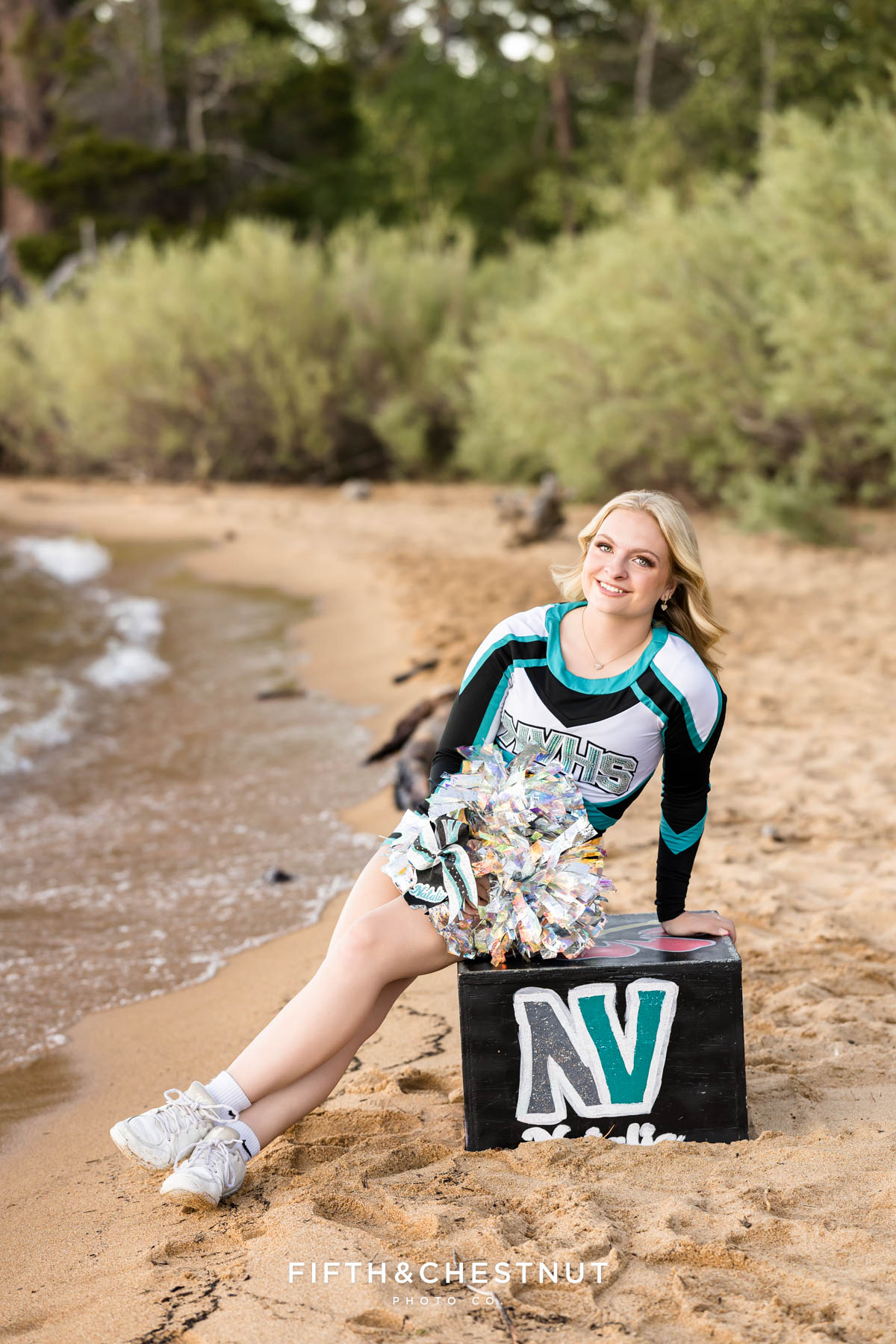 Senior cheer portrait on Kiva Beach in North Valleys High School uniform