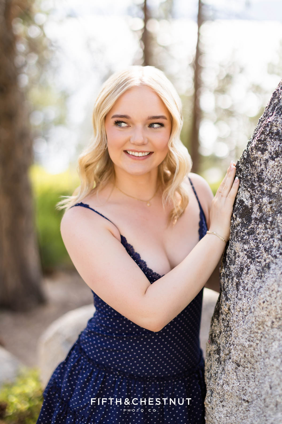 Bishop Manogue Senior posing on a forested trail in Incline Village for senior portraits