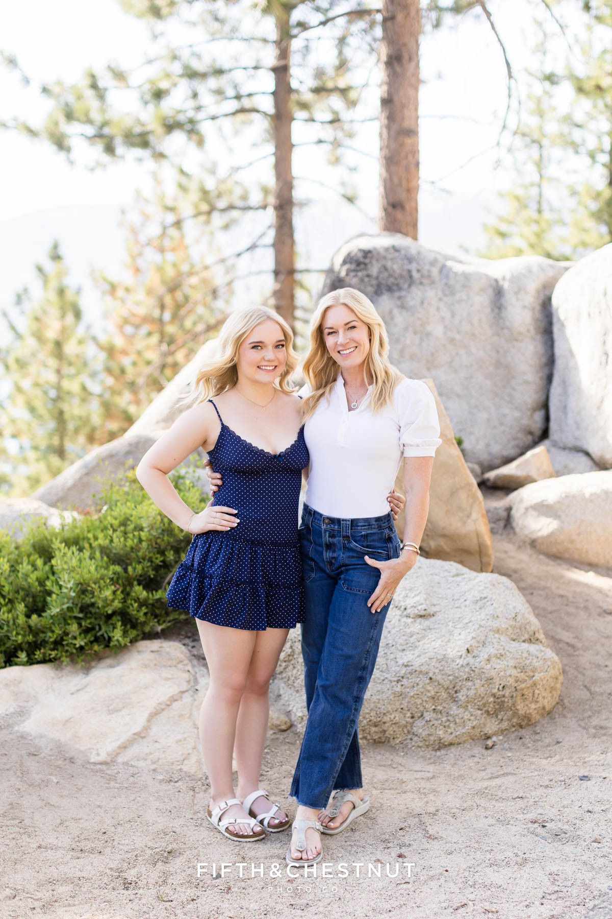 Bishop Manogue Senior posing with her sweet mom on a forested trail in Incline Village for senior portraits