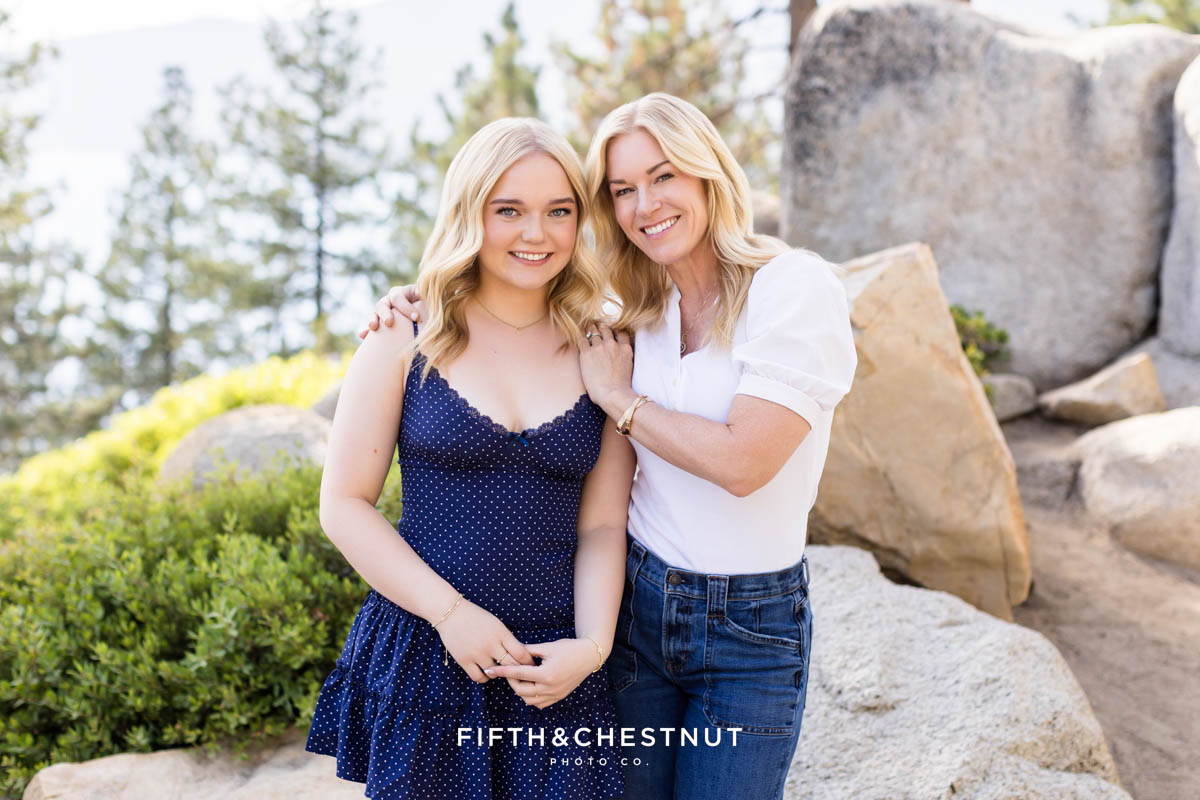 Bishop Manogue Senior posing with her sweet mom on a forested trail in Incline Village for senior portraits