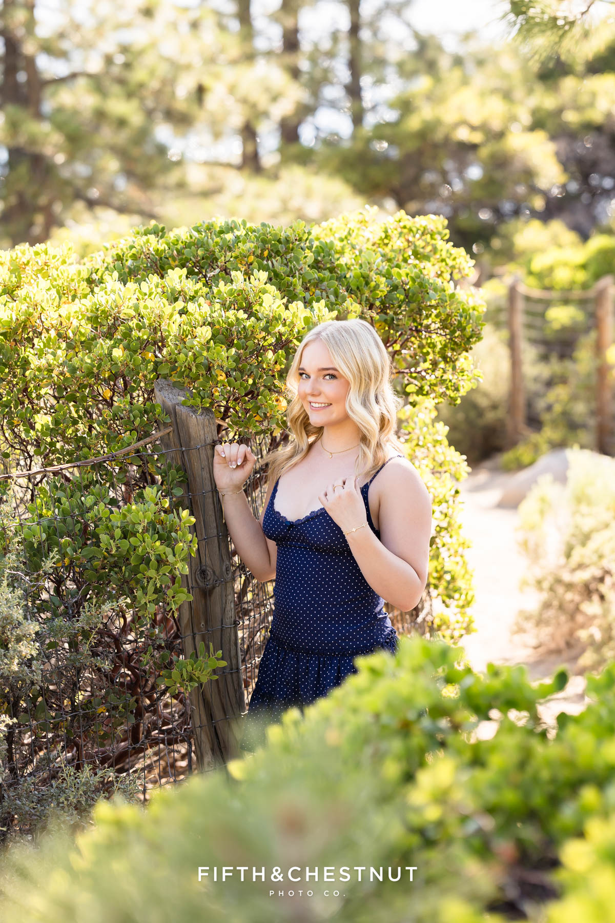 Bishop Manogue Senior posing with her sweet mom on a trail that leads to a beach in Incline Village for senior portraits